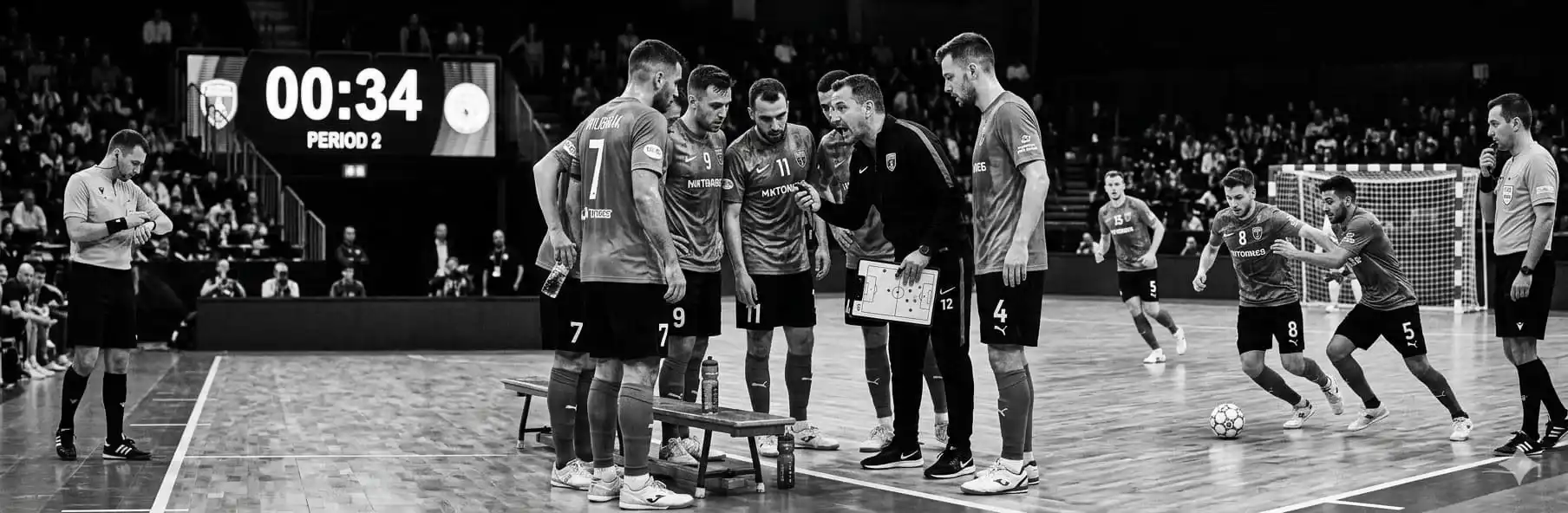 Futsal coach managing time in the final minutes of a match