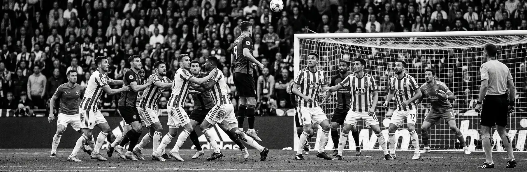 Football defenders organised to defend an opposition corner in the box
