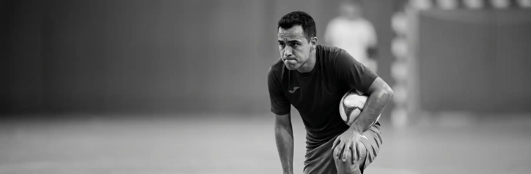 Futsal player preparing to take a direct free kick