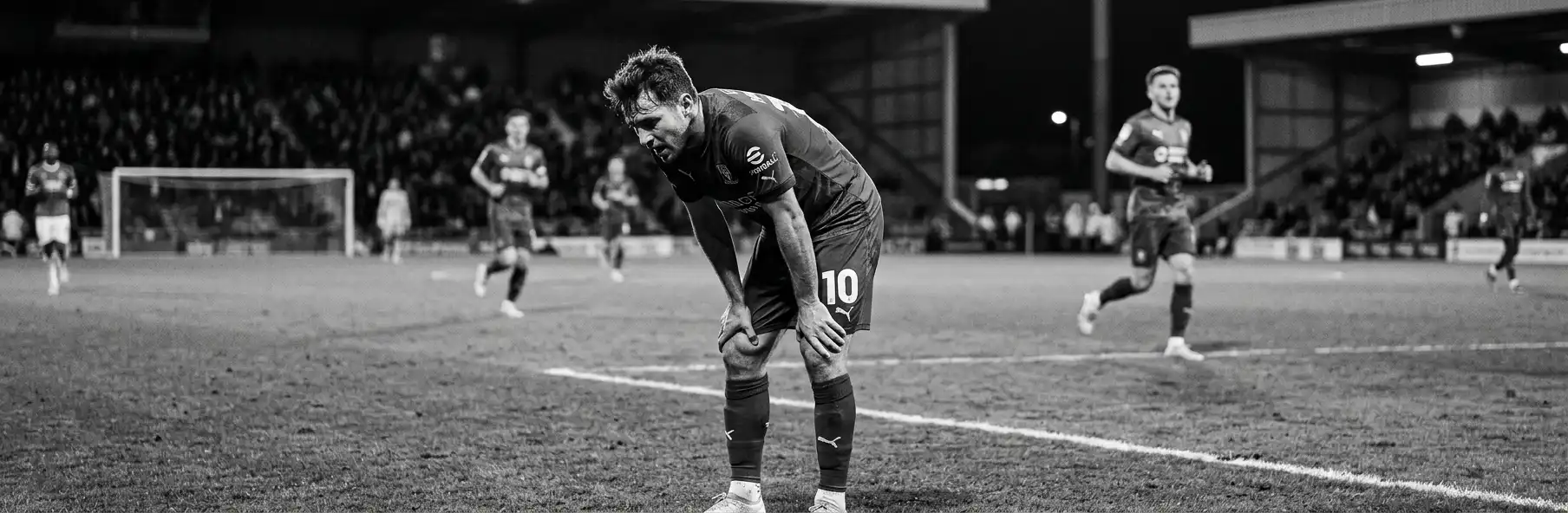 Screen showing a heat map and kilometres covered by a football player next to the pitch
