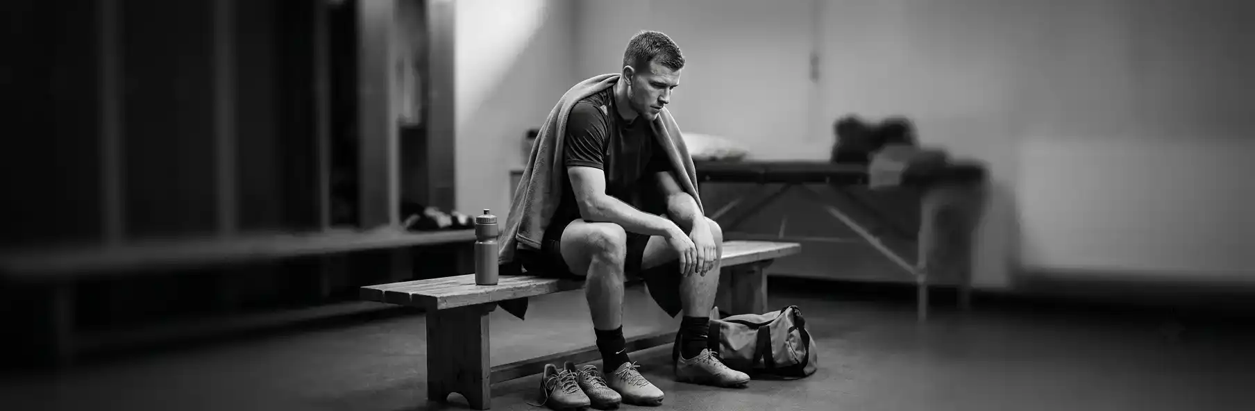 Football player resting between double training sessions during pre-season