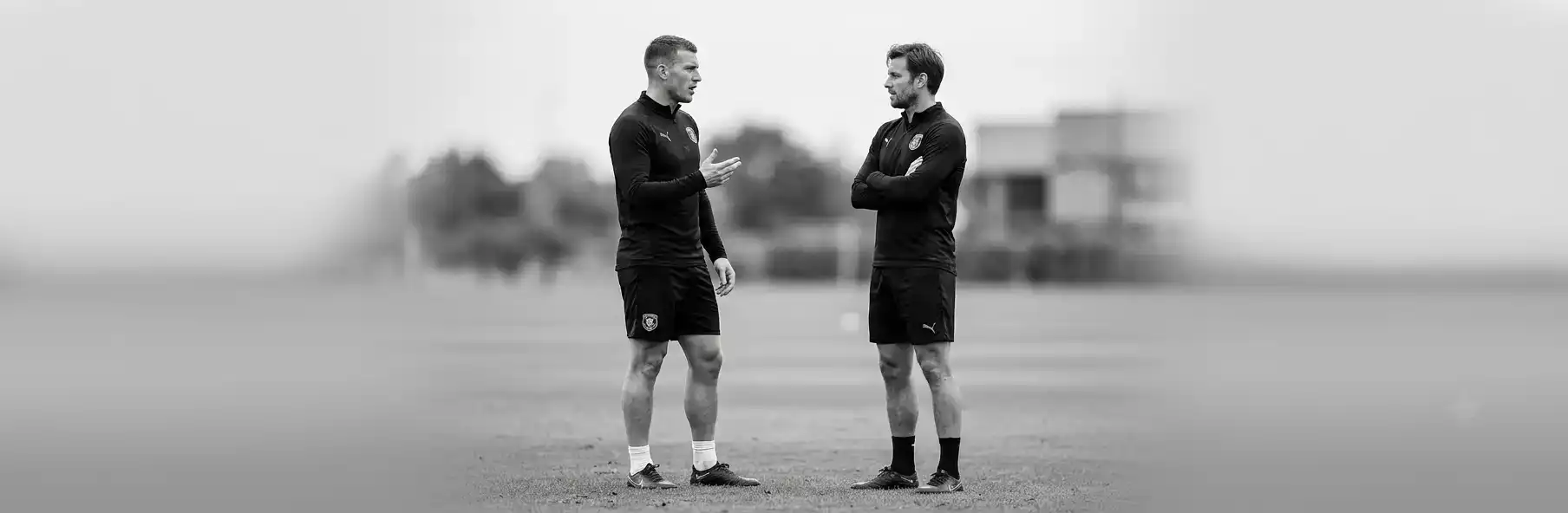 Football manager analysing two players' statistics to decide the starting XI