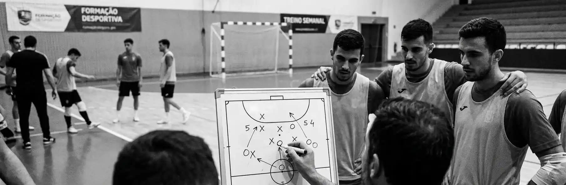 Futsal team training 5v4 defence with opposing outfield goalkeeper in numerical inferiority