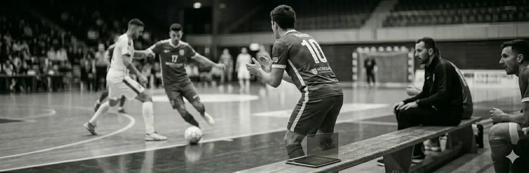 Futsal bench players receiving data-based feedback from their coach during a match