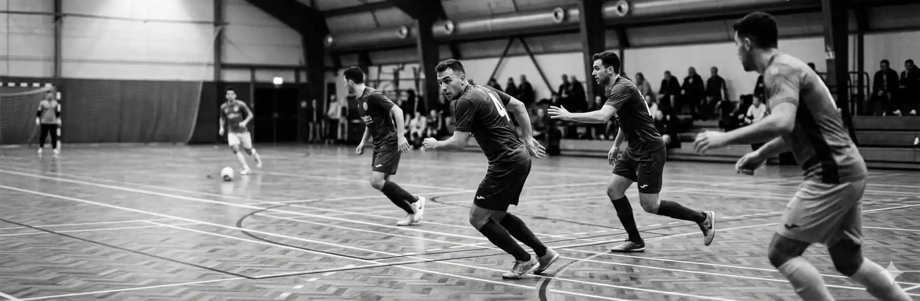 Futsal players reorganising defensive positioning after losing possession