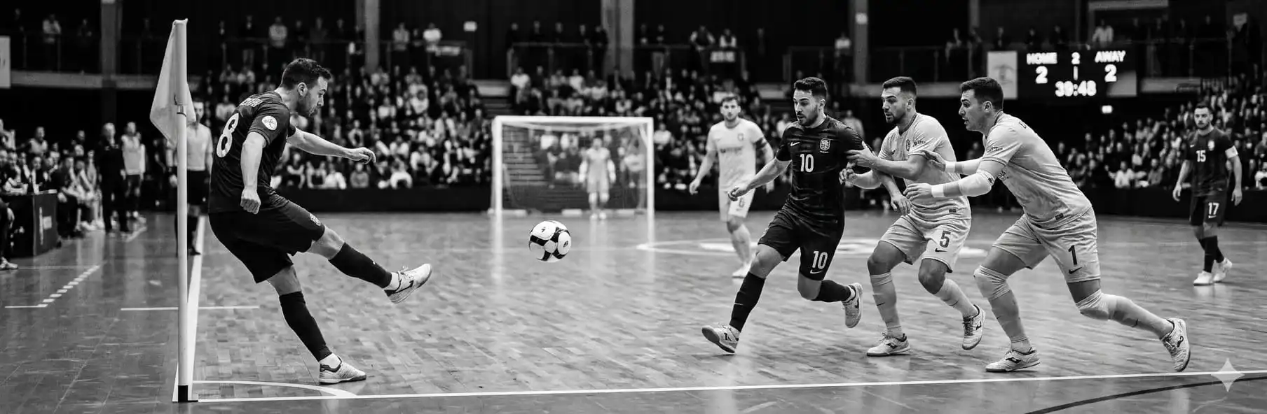 Futsal players executing a set piece routine on an indoor court