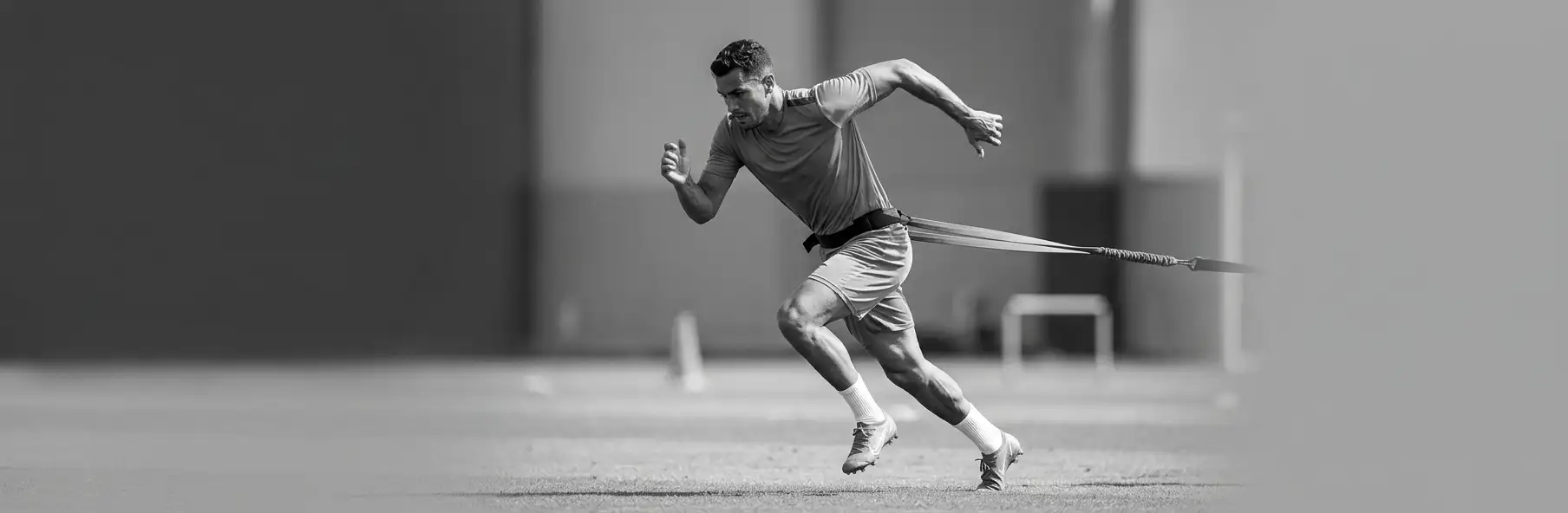 Football player performing a sprint during speed training